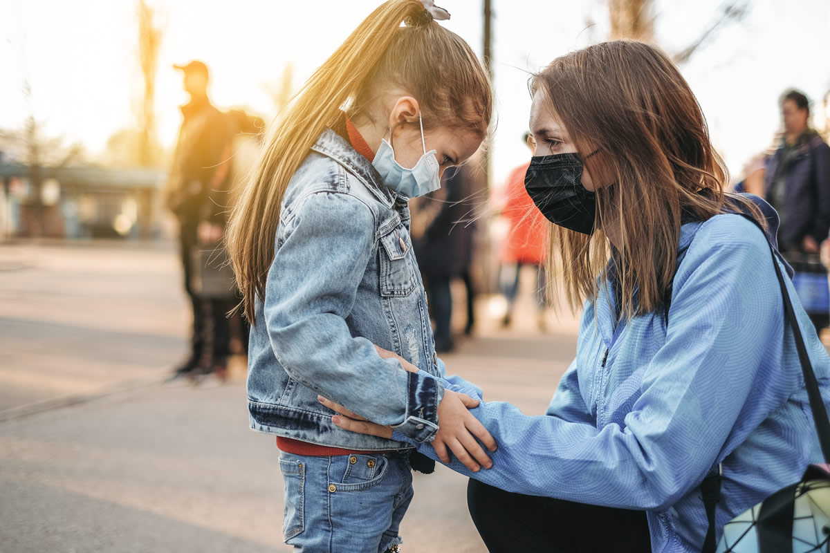 Woman and Child wearing masks